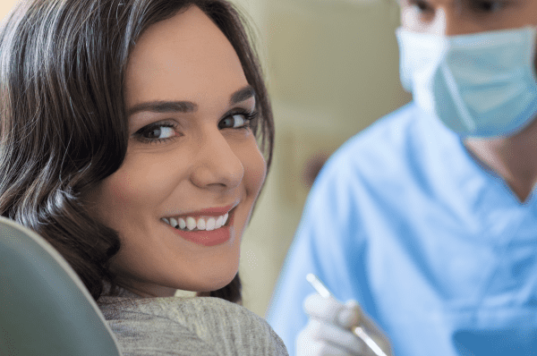 Smiling Woman at Dentist Office