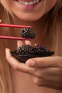 Woman eating Berries